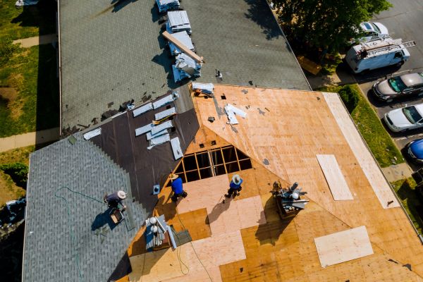 Storm Damage Repair in Norwalk Roof Storm Damage Repair in Norwalk, IA by Professional Roofing & Construction – crew working on roof restoration after storm damage